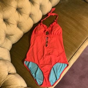 Guess one piece, halter bathing suit, orange on outside with gold embellishments